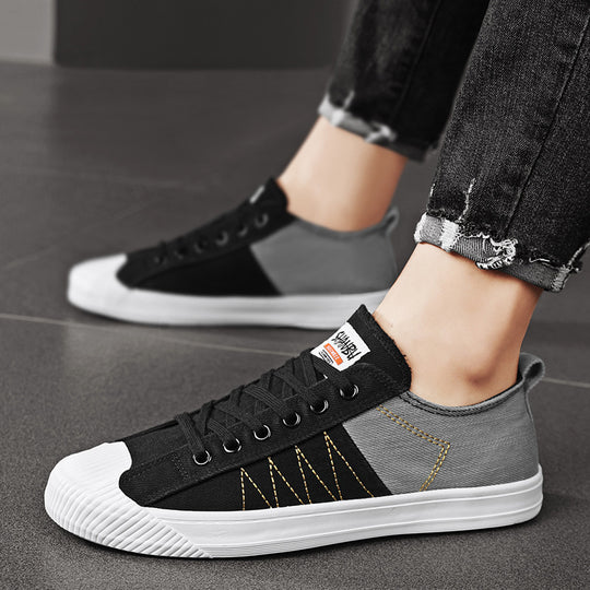 Unisex niedrige Canvas-Sneaker mit verstärkter Gummi-Zehenkappe und kontrastierenden Textilpaneelen EB