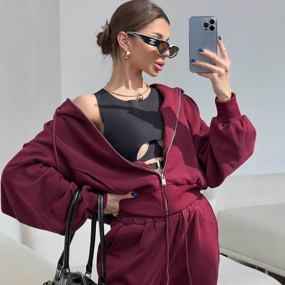 Damen kurzes Kapuzen-Sweatjacke mit Balloonärmeln und elastischer High-Waist Palazzo-Freizeithose Eichborn Berlin