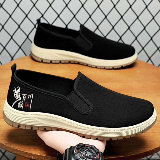 Herren nan nahtloser Canvas-Slip-On mit elastischem Einstieg, besticktem Fersenmotiv und rutschfester EVA-Laufsohle EB