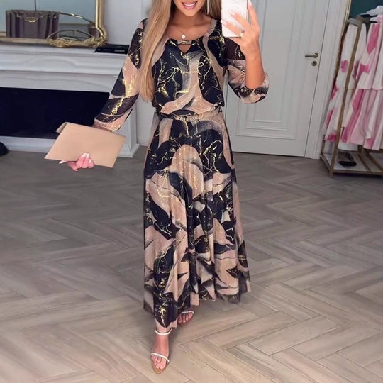 Damen Maxikleid mit elegantem Druckdesign und fließendem Schnitt Heidi-Mode