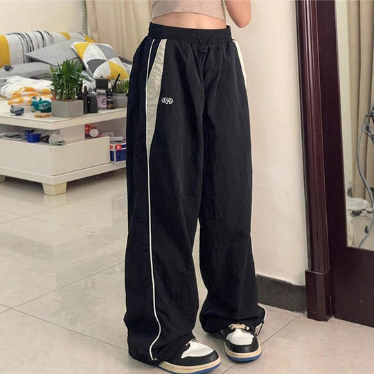 Damen nan weite Trackhose mit Kontrastpaspel, elastischem Bund und Oversize-Schnitt EB