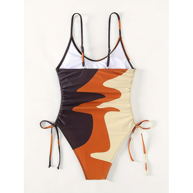 Damen Einteiler Badeanzug mit asymmetrischem Muster und verstellbarem Bindeband EB