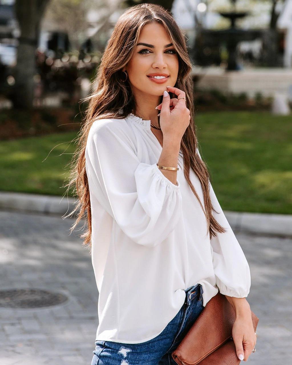 Damen Bluse mit legerem V-Ausschnitt und elegantem Puffärmel EB