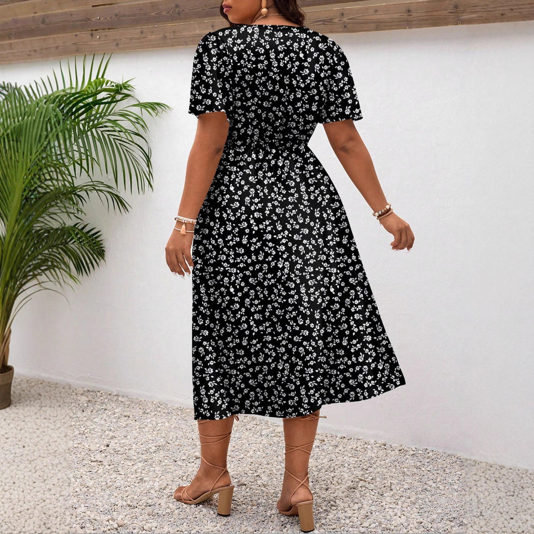 Damen Midi-Kleid mit Blumenmuster und vorteilhaftem Schlitz EB