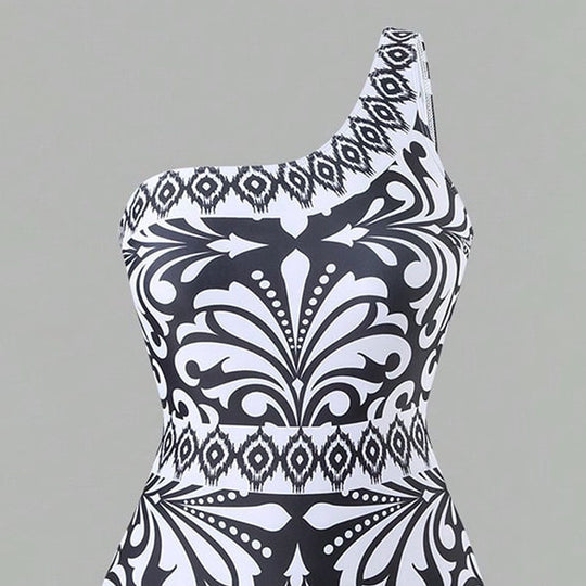 Damen Einteiler Badeanzug mit elegantem asymmetrischen Design und passender Hose EB