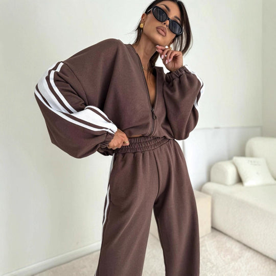 Damen cropped Zip-Hoodie mit voluminösen Ballonärmeln und High-Waist Relaxhose im sportlichen Seitenstreifen-Design Eichborn Berlin