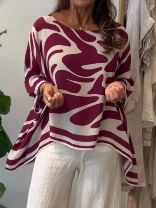 Damen Oversize Sommerbluse mit abstraktem Print, Fledermausärmeln und asymmetrischem Saum EB