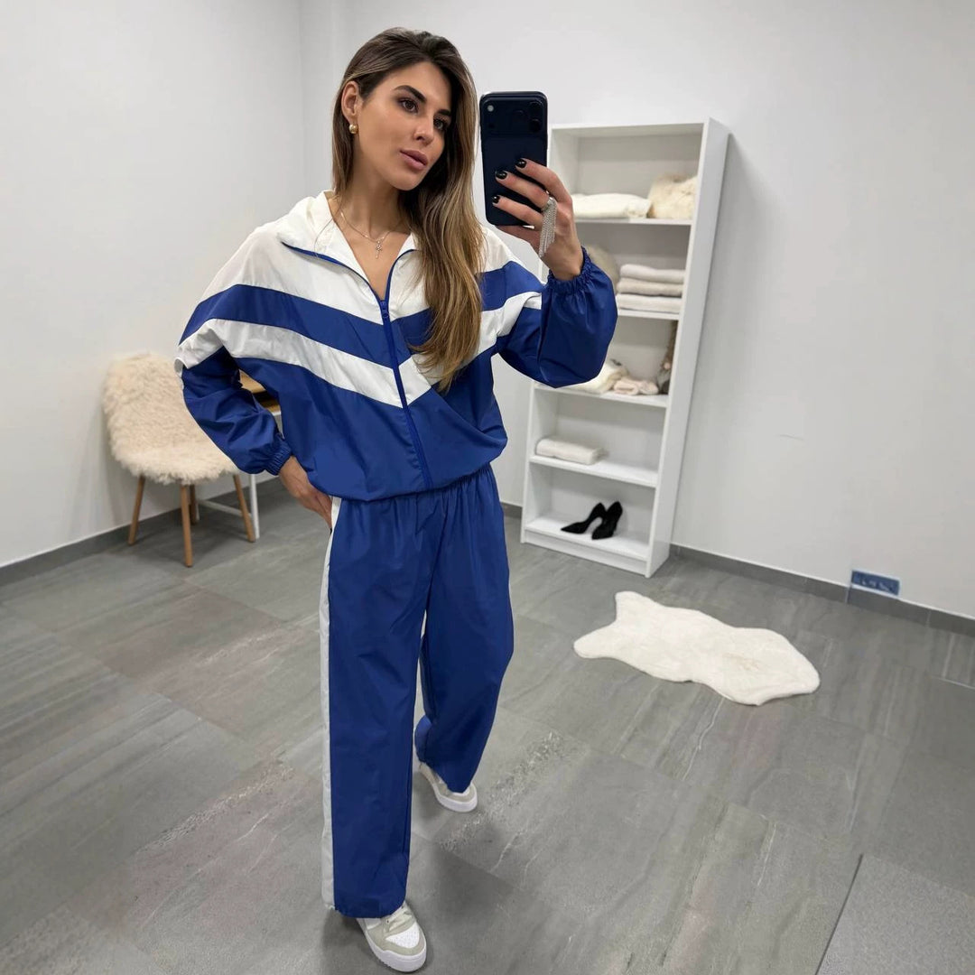 Damen retro Nylon-Trainingsanzug mit Kapuzen-Zipjacke und weiter hochgeschnittener Hose Eichborn Berlin