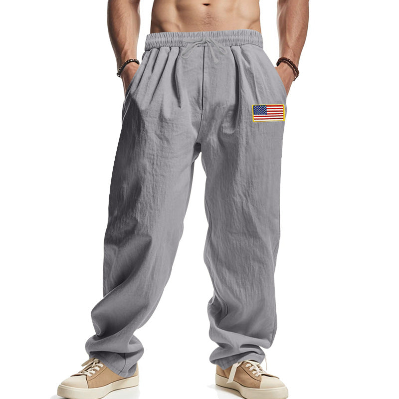 Herren Locker sitzende Freizeit-Hose im Leinen-Look mit elastischem Bund, Kordelzug & Flaggenpatch EB