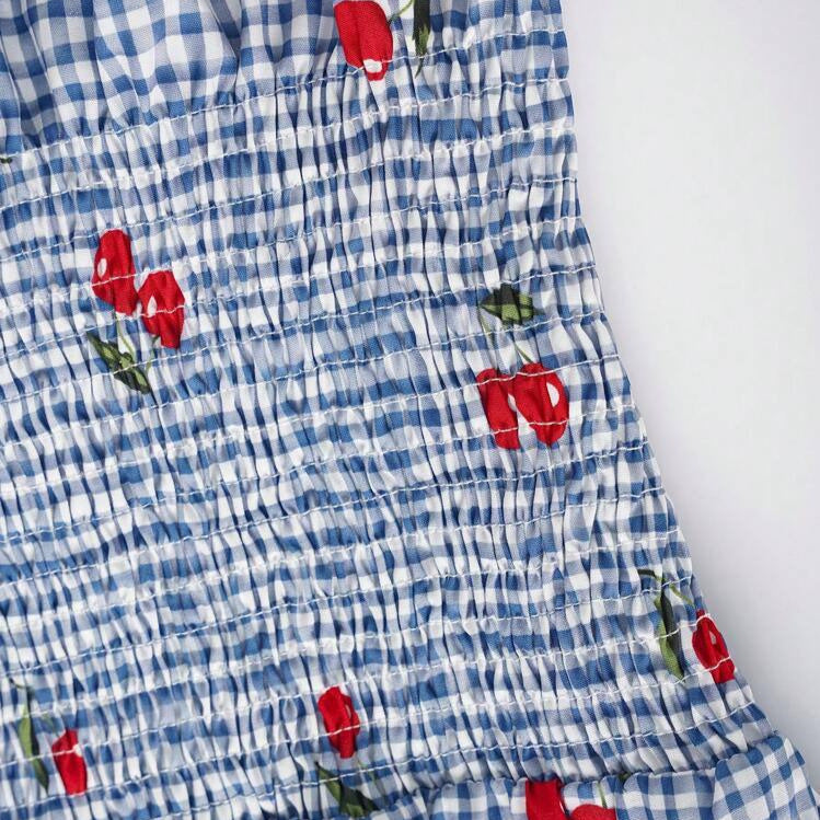 Damen Bluse mit floralem Karo-Muster und Rüschensaum EB