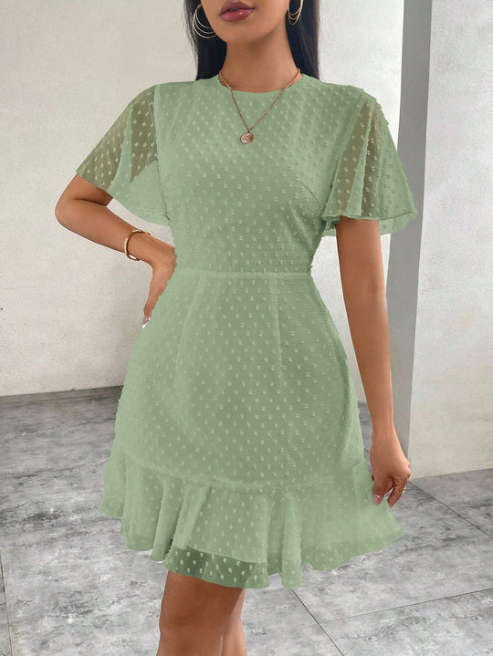 EB | Dreidimensionales Kleid mit Rüschenrand und Punkten