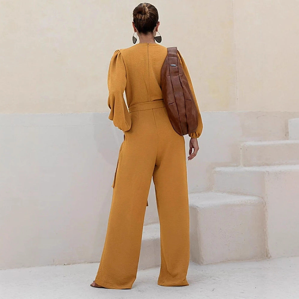 Damen Eleganter Palazzo-Jumpsuit mit tiefem V‑Ausschnitt, Bindegürtel und Ballonärmeln EB