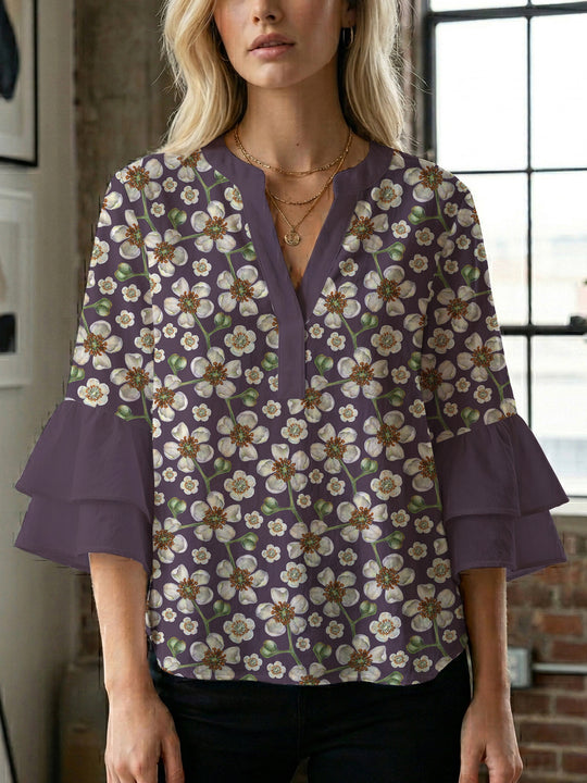 Damen Bluse mit voluminösen Ärmeln und floralem Design EB