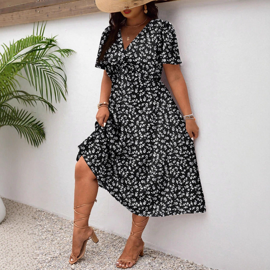 Damen Midi-Kleid mit Blumenmuster und vorteilhaftem Schlitz EB