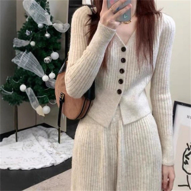 Damen Elegantes gestricktes Jumpsuit mit Knopfdetails und weitem Bein EB