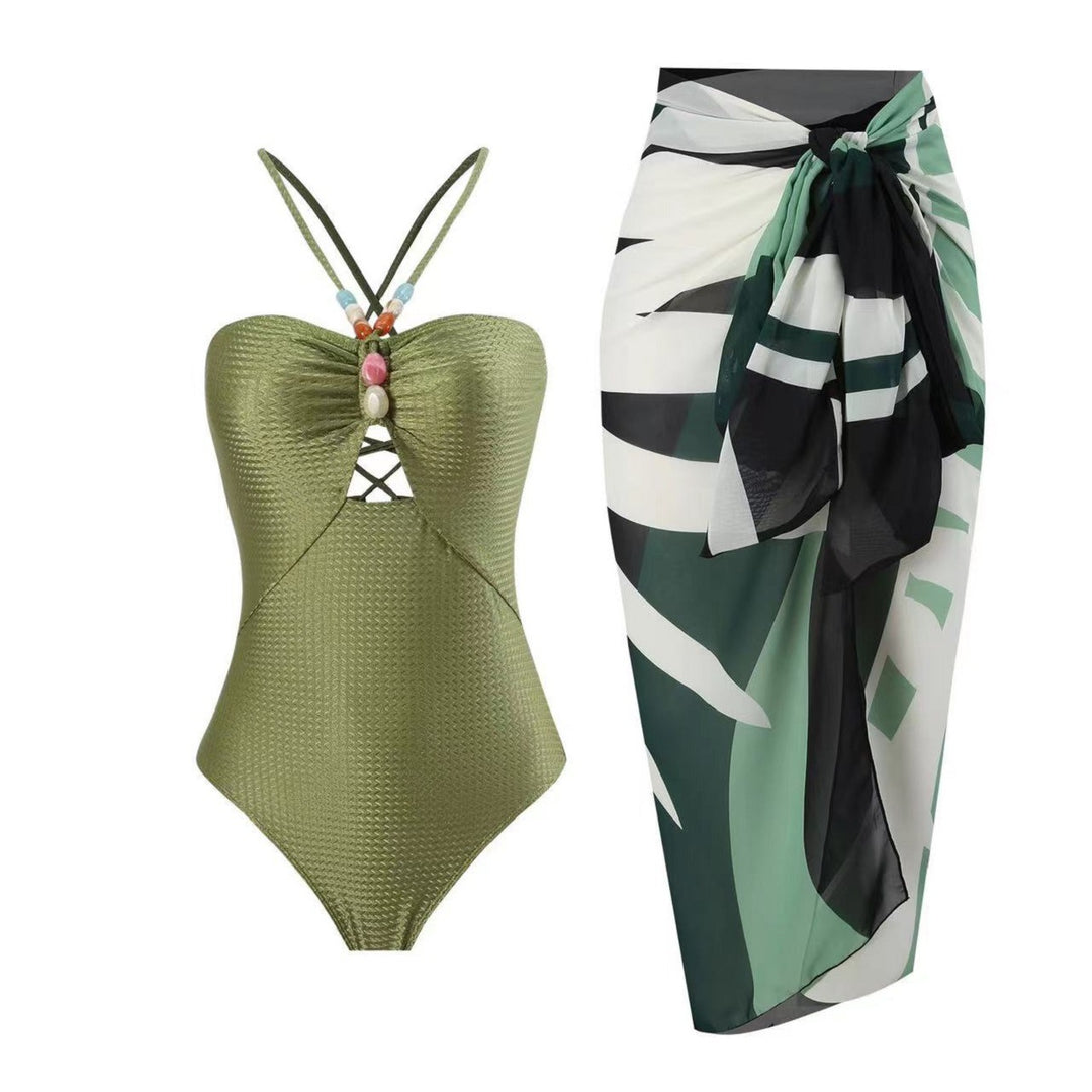 Damen Badeanzug mit elegantem Wickelrock und modischen Schmuckdetails EB
