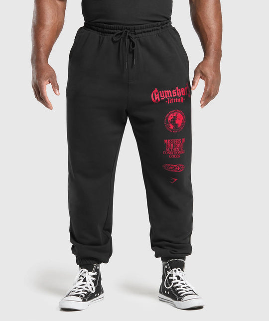 Herren nan konisch geschnittene Baumwollfleece-Sweathose mit elastischem Kordelbund gerippten Beinabschlüssen und großflächigem Logodruck EB
