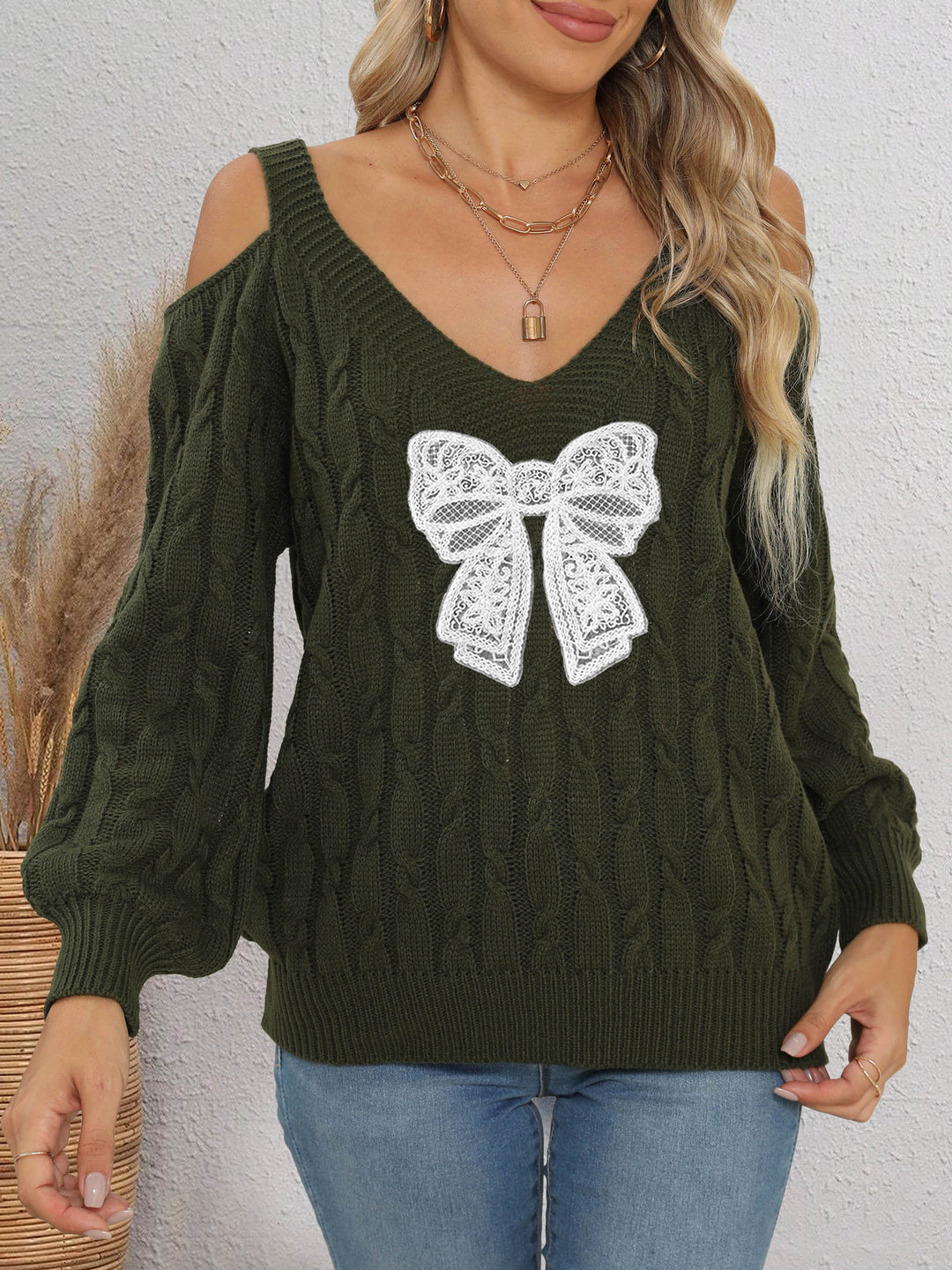 Damen modischer Pullover mit verspielt eingestricktem Schleifenmotiv EB