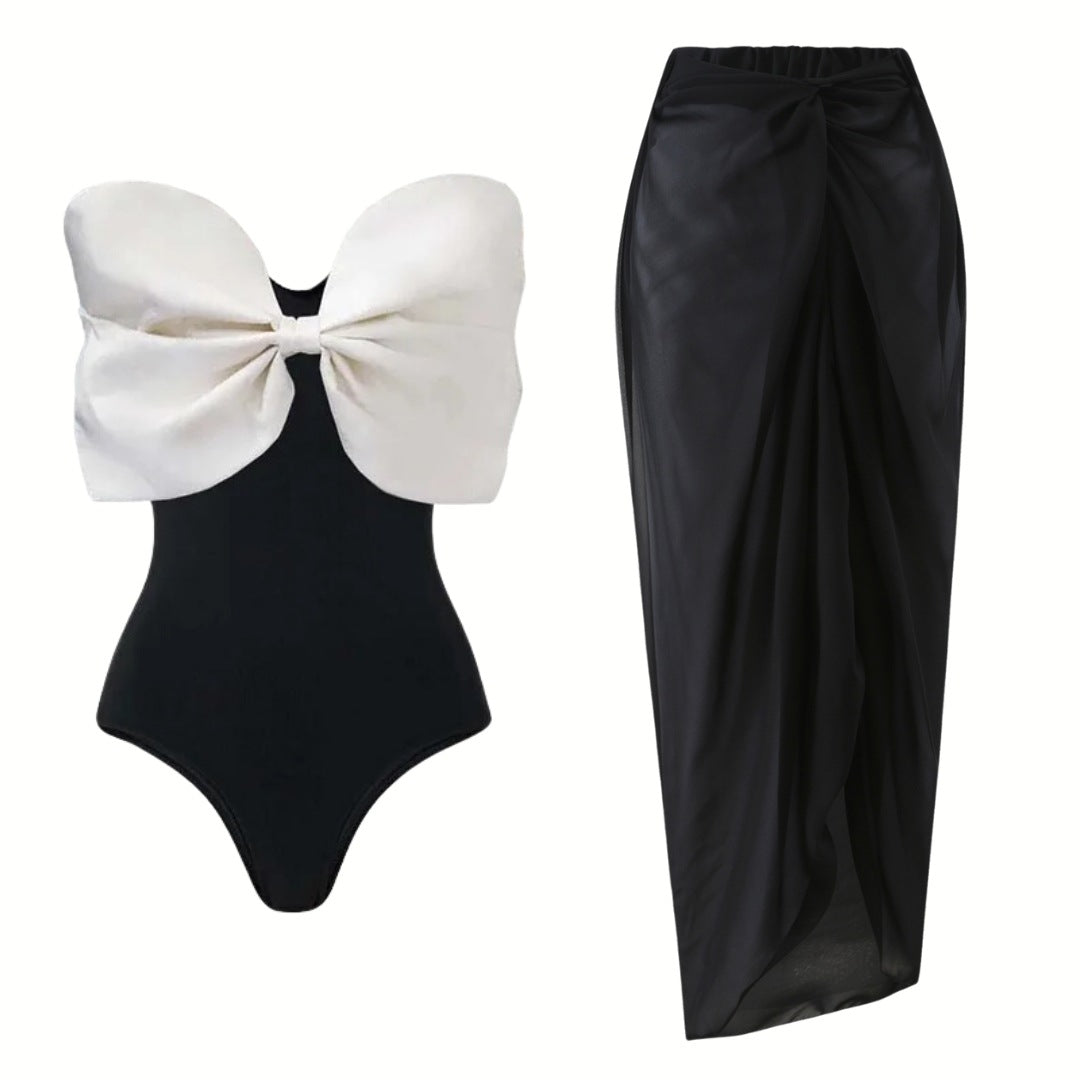 Damen Einschnitt Badeanzug mit voluminösem Schleifen-Detail und elegantem Wickelrock EB