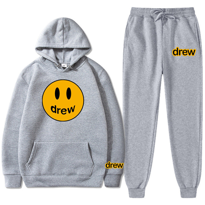 Unisex nan zweiteiliges Lounge-Set aus French-Terry mit Smiley-Print Kapuzenpullover und tapered Jogginghose EB