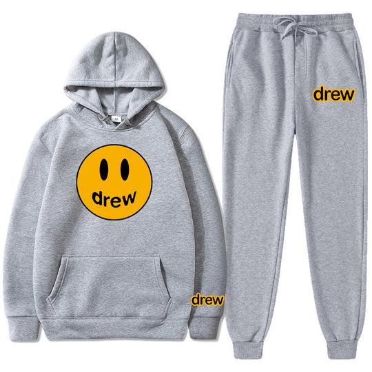 Unisex nan zweiteiliges Lounge-Set aus French-Terry mit Smiley-Print Kapuzenpullover und tapered Jogginghose EB