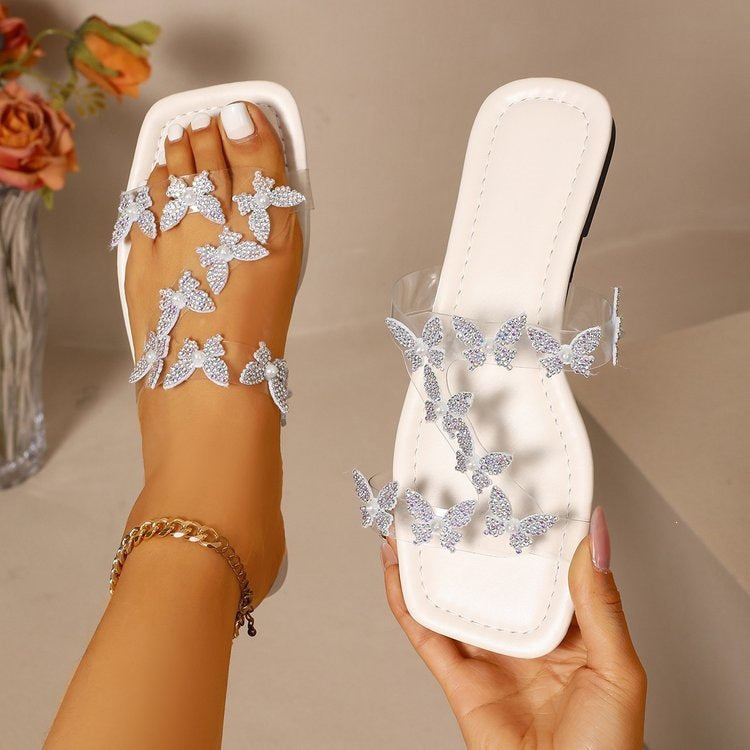 Damen Elegante Sandalen mit transparentem Riemen und floralem Design EB