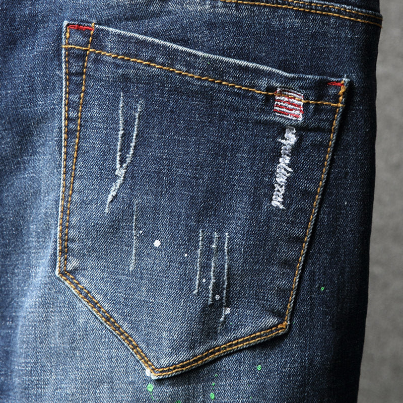 Herren Ripped Slim Fit Jeans mit kreativen Farbklecksen und modischem Destroyed-Look EB