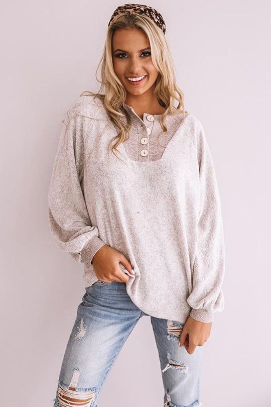 Damen Lässiger Sweatshirt mit Knopfleiste und voluminösen Ärmeln EB
