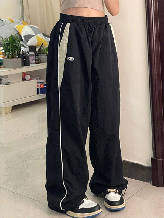Damen nan weite Trackhose mit Kontrastpaspel, elastischem Bund und Oversize-Schnitt EB