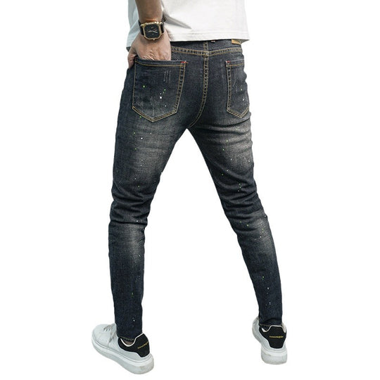 Herren Skinny Fit Jeans im kreativen Rissdesign und bunten Farbsklecks EB
