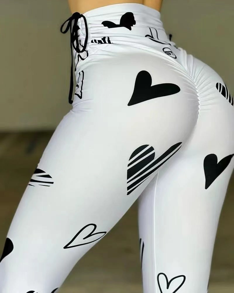 Damen Hochbund-Leggings mit grafischem Herzmuster und hochelastischem Material EB