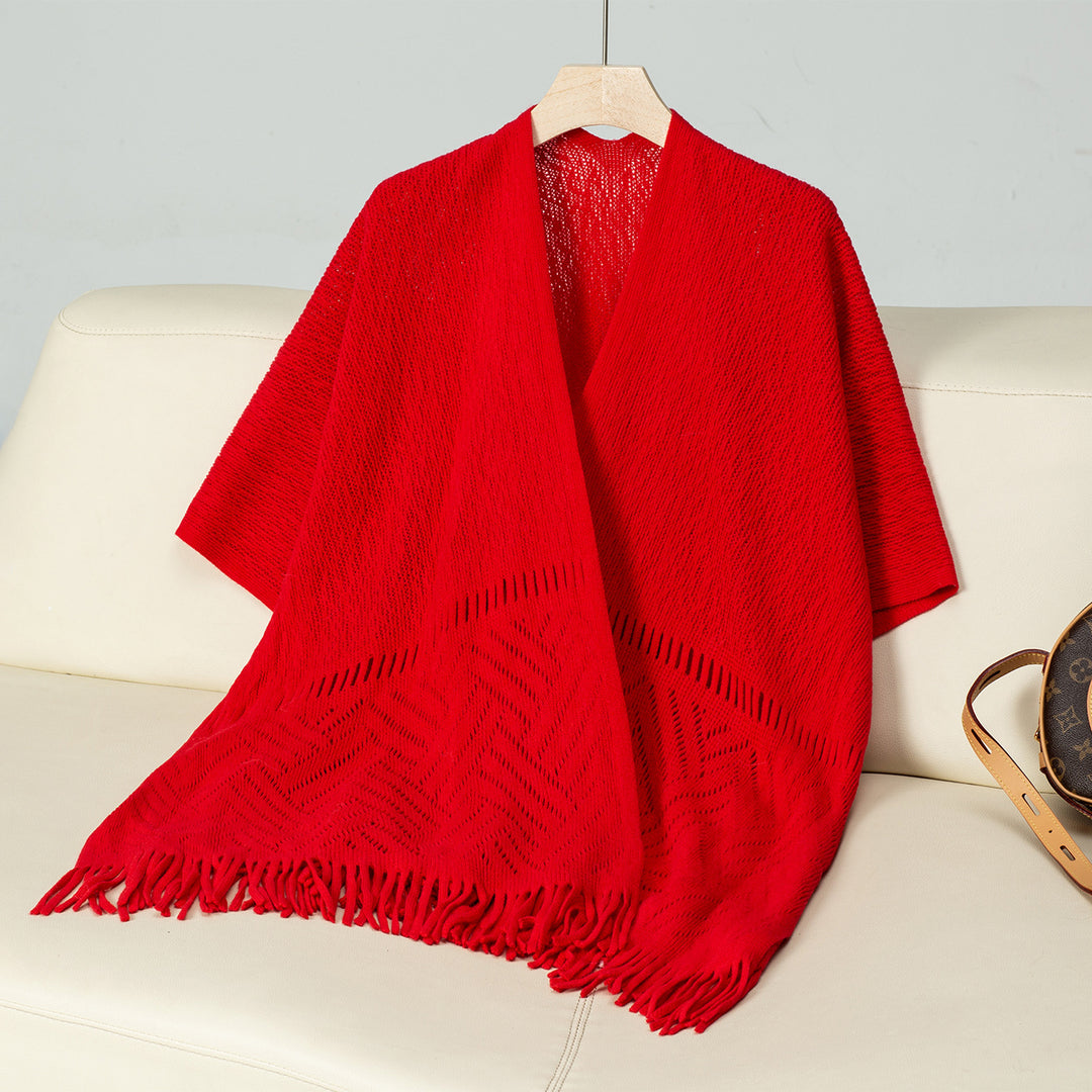 Damen eleganter Strickponcho mit fransigen Details und markantem Muster EB