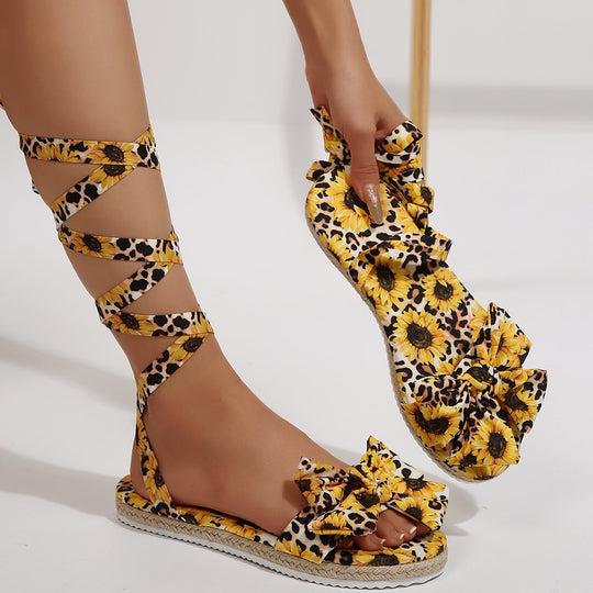 Damen Gladiator-Sandalen mit Blumendruck und Schleifenakzent EB