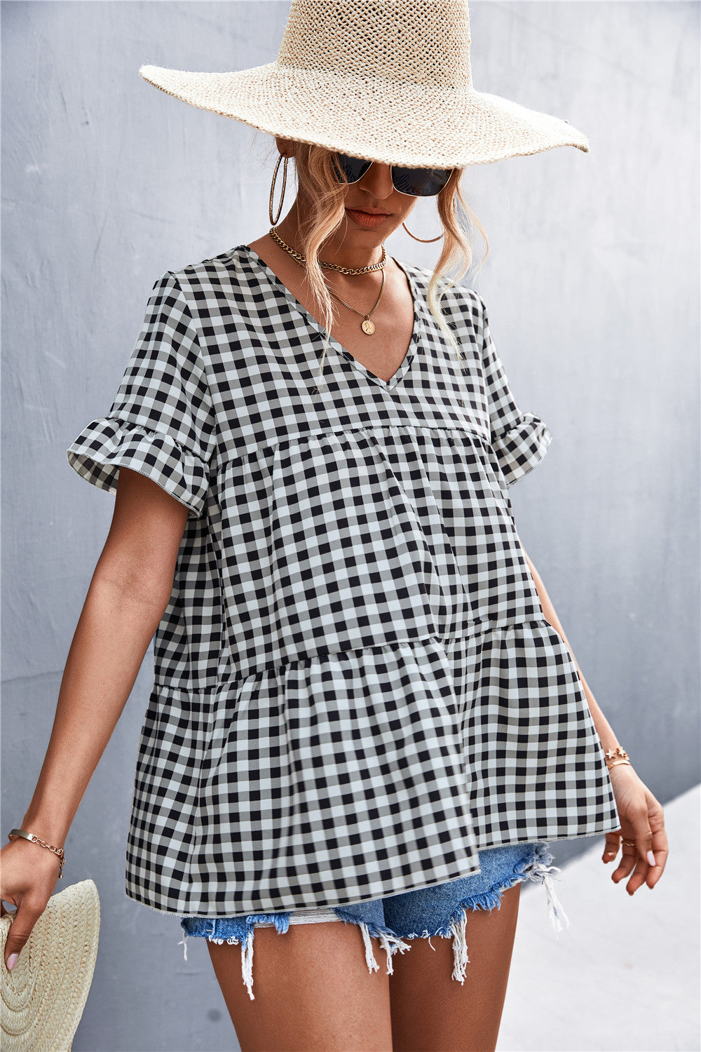 Damen Blusenshirt mit rüschenförmigem Saum und Karomuster EB