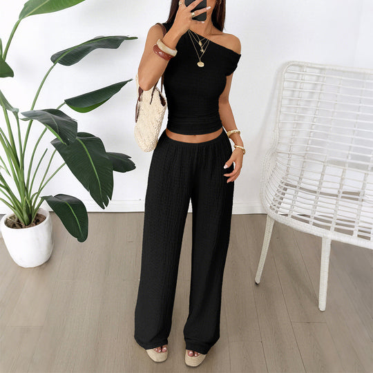 Damen Zweiteiliges Set aus elastischem Rippstoff mit asymmetrischem Top und weitem Hosen EB