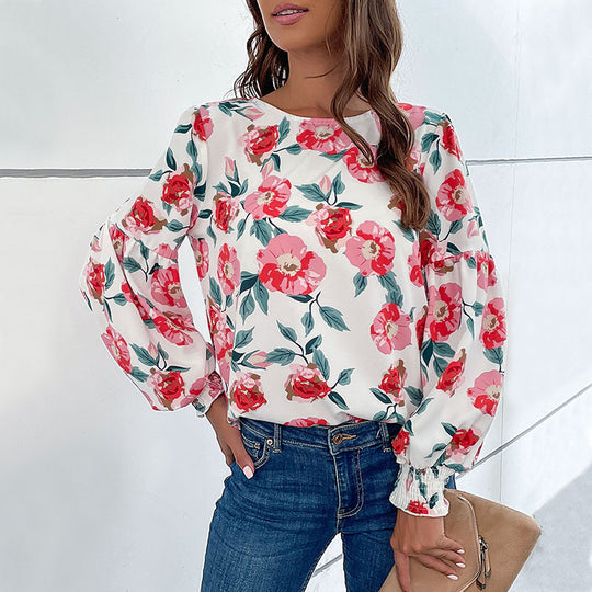 Damen Bluse mit floralem Design und voluminösen Ärmeln EB