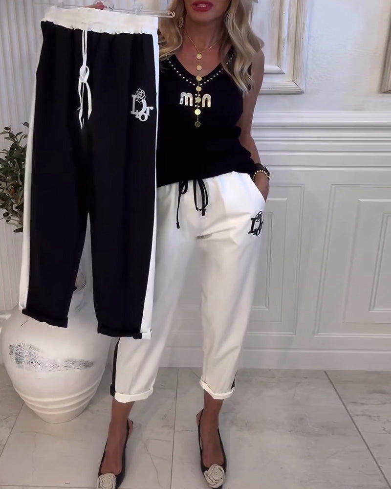 Damen nan Cropped-Jogginghose mit kontrastierendem Bund, seitlichem Zierstreifen, Kordelzug und Logostickerei EB