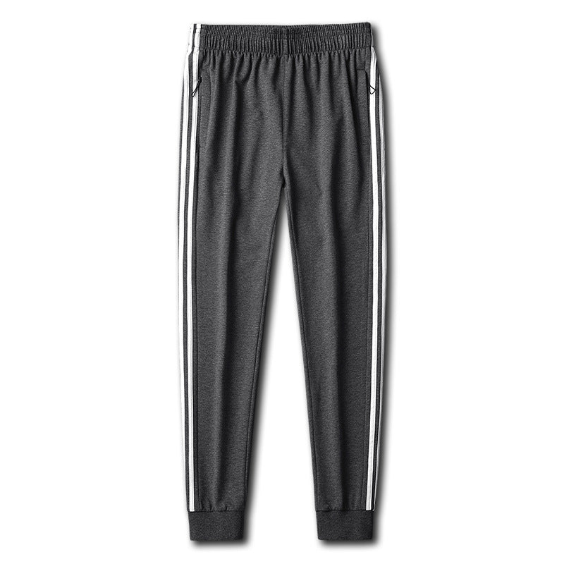 Herren Slim-Fit Trackhose mit seitlichen Kontraststreifen, Reißverschlusstaschen und elastischem Bund EB