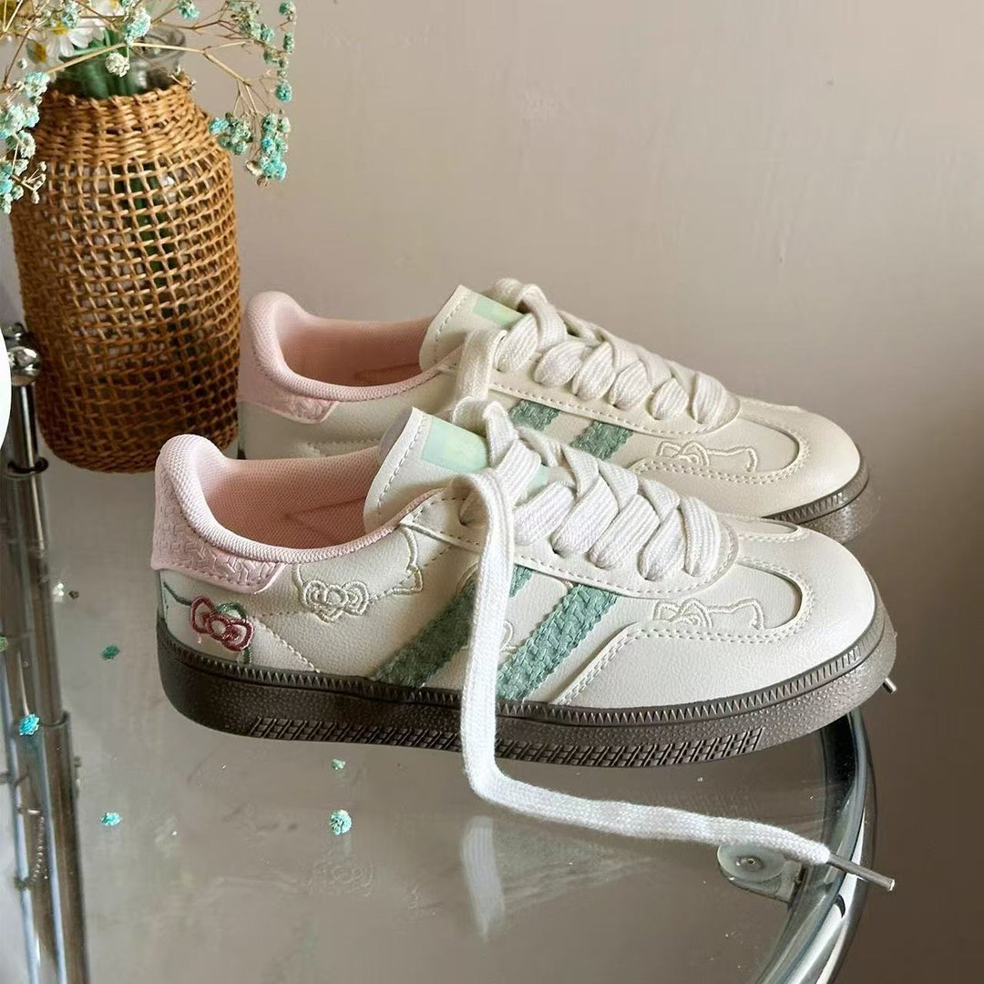 Damen Sneaker mit floralen Applikationen und elastischen Schnürsenkeln EB