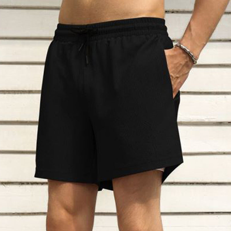 Herren nan zweilagige Schwimmshorts mit innerer Kompressionshose und seitlicher Smartphone-Tasche EB