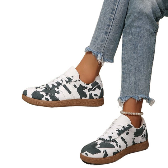 Damen Sportliche Sneakers mit trendigem Kuhdesign EB