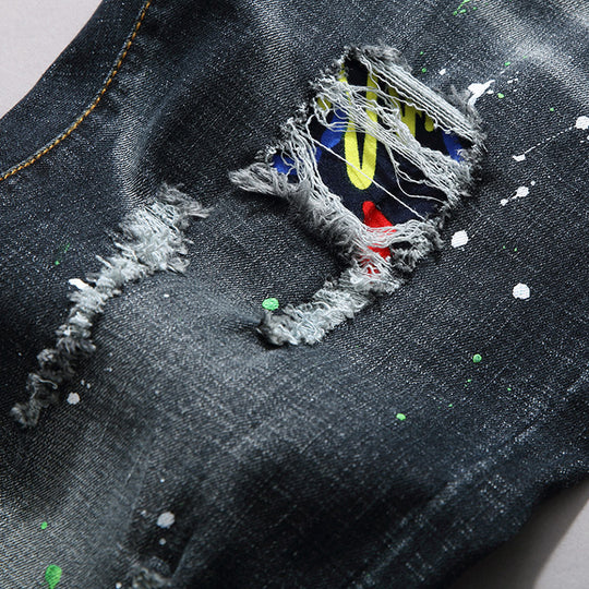 Herren Slim Fit Jeans mit kreativen Rissdesign und Farbklecksen EB
