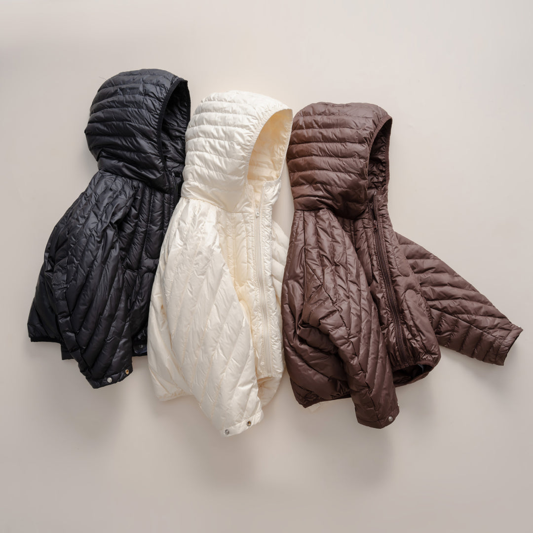 Damen gesteppte Jacke mit Kapuze und trendigem Design EB