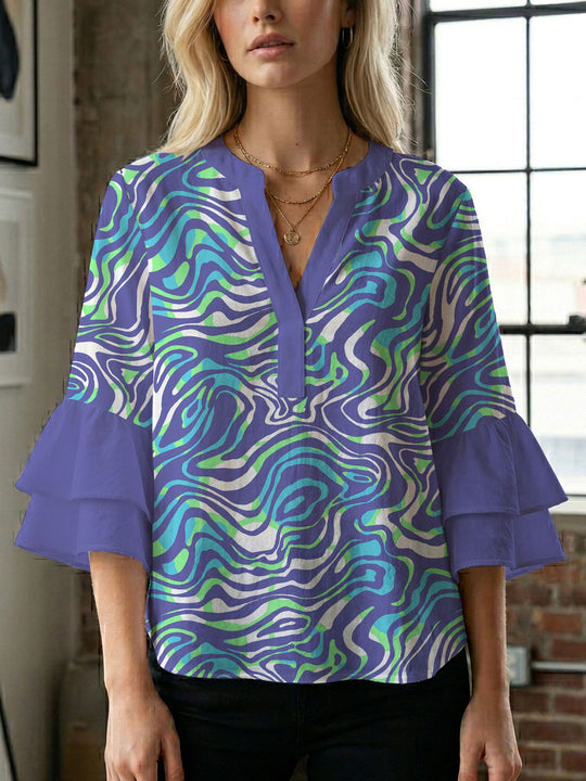 Damen Bluse mit voluminösen Flügelärmel und intensivem Blattmuster EB