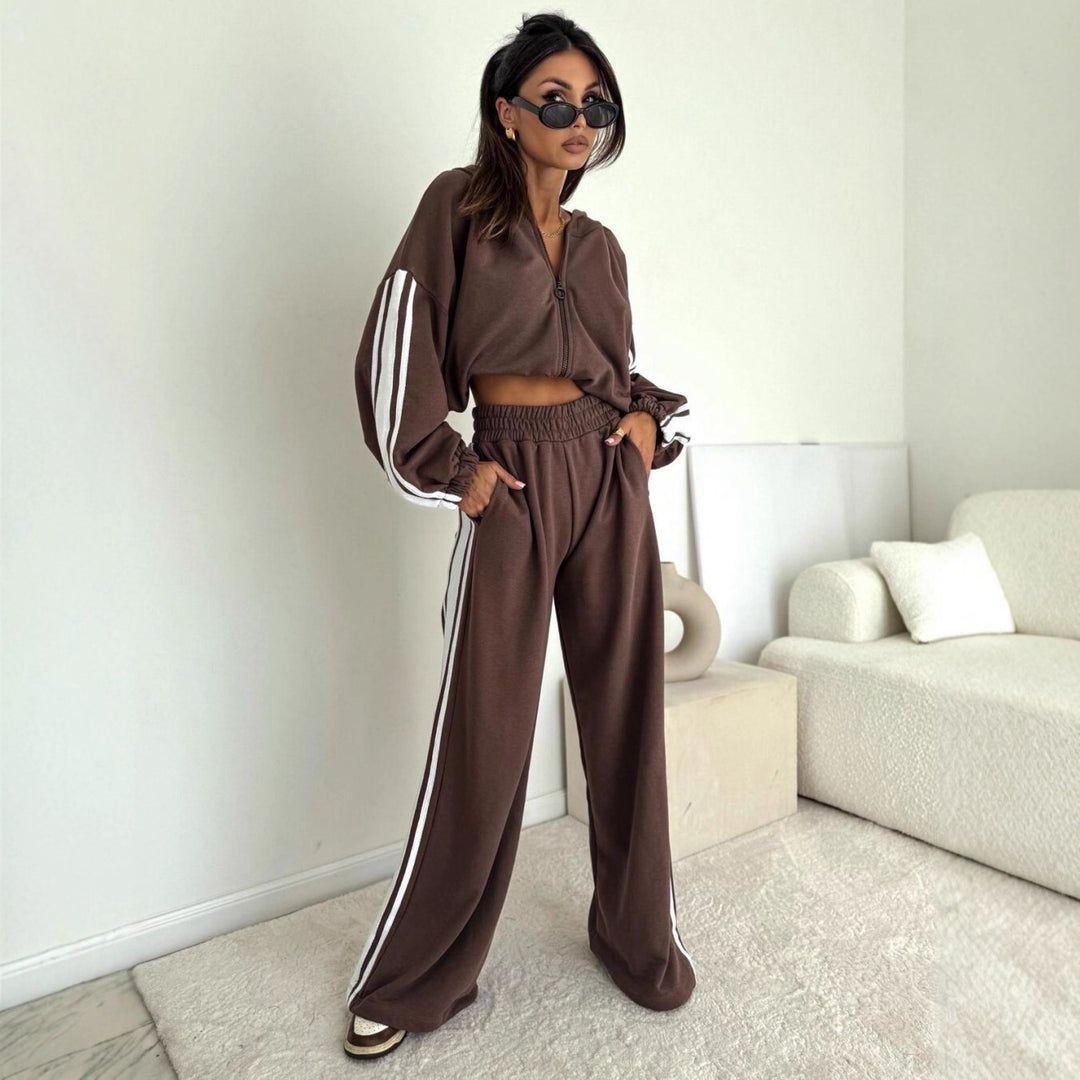 Damen cropped Zip-Hoodie mit voluminösen Ballonärmeln und High-Waist Relaxhose im sportlichen Seitenstreifen-Design Eichborn Berlin