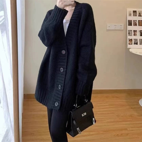 Damen Grobstrickjacke mit voluminösen Ärmeln und knöpfbarem Ausschnitt EB
