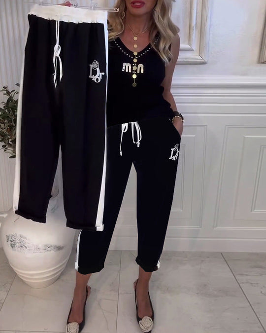 Damen nan Cropped-Jogginghose mit kontrastierendem Bund, seitlichem Zierstreifen, Kordelzug und Logostickerei EB