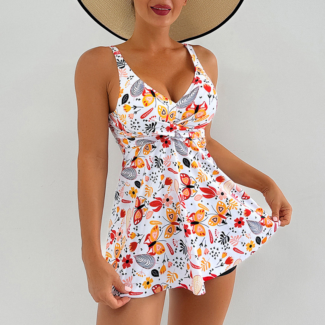 Damen Sportlicher Badeanzug mit fließendem Rock und floralen Akzenten EB