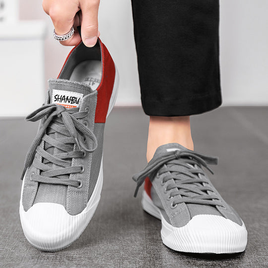 Unisex niedrige Canvas-Sneaker mit verstärkter Gummi-Zehenkappe und kontrastierenden Textilpaneelen EB