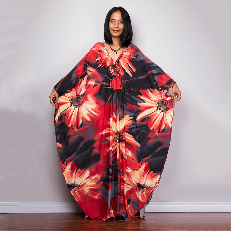 Damen Maxikleid mit kunstvollem Pfauenmuster und seitlichen Schlitzen Heidi Mode